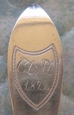 spoon showing two sets of initials and the year 1822