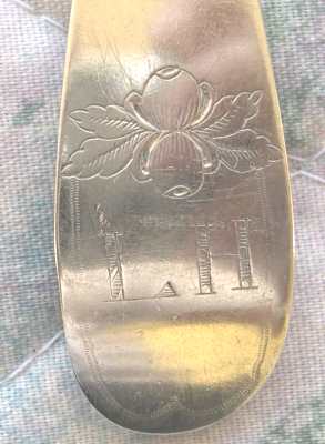 spoon with one set of initials, possibly a birth or funeral spoon
