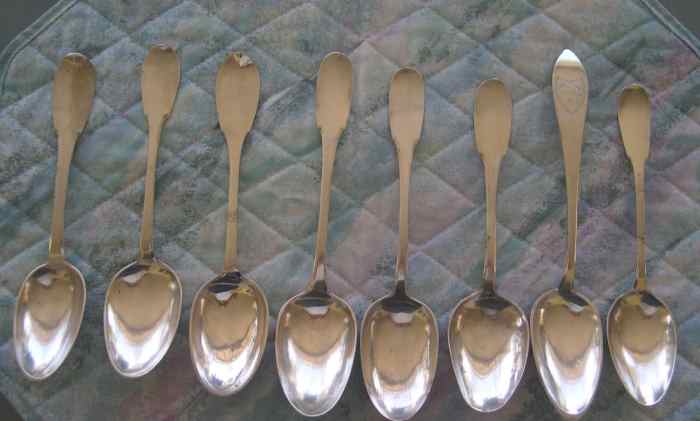 A picture of all 8 spoons from the front