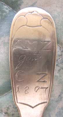 spoon showing two sets of initials and the year 1807