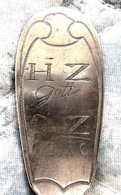 spoon showing two sets of initials and the year 1810