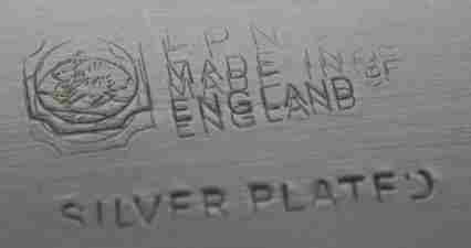 silver plate mark on a meat cover with Bennie and other family crest