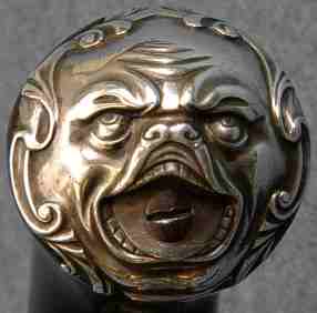 silver 'grotesque' pistol buttcap
