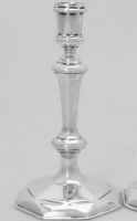 A Queen Anne octagonal base and shape cast candlestick with diamond facets  London 1712