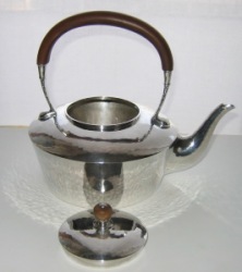 silver tea kettle manufactured by Liberty & Co