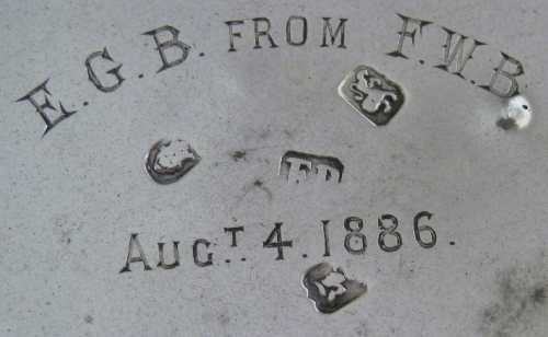 circular silver box with Buxton crest