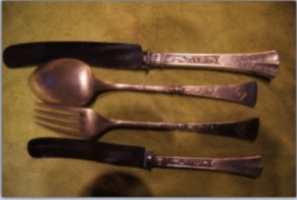 silver flatware set marked Switzerland