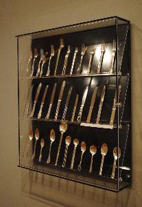 Unusual wall cases allow for better comparison of flatware patterns