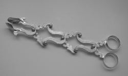 Engine turned sugar tongs of the type called in American silver terminology lazy tongs