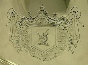 Crest on the left side of teapot