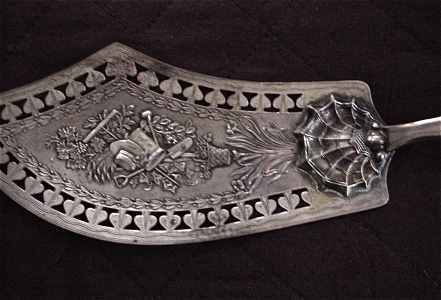 ornate silver knife server