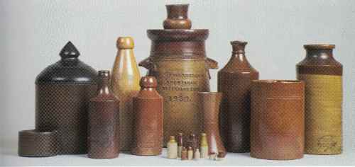 Butter churn dated 1835 with a selection of 19th century and early 20century Denby pottery