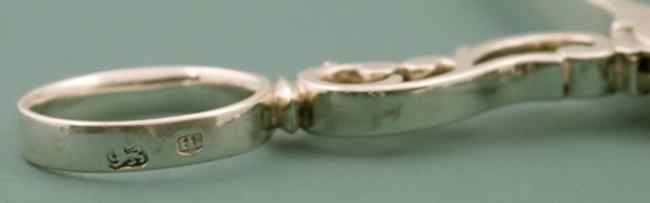 silver hallmarks on the tongs