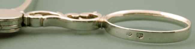 silver hallmarks on the tongs