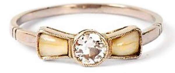 gold ring set with two baby teeth