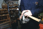 The body dents are removed with heads that conform to the compound curve that's being burnished out