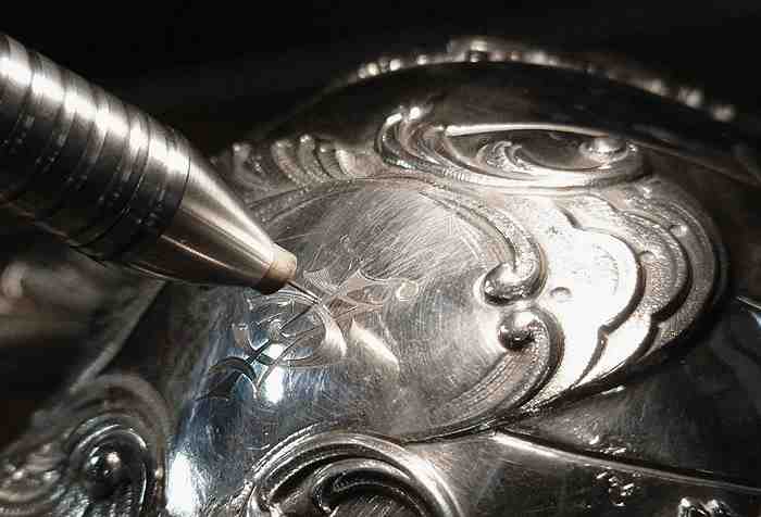 Jeffrey Herman filling in engraving with sterling, not silver solder