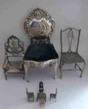 A selection of silver chairs in various sizes