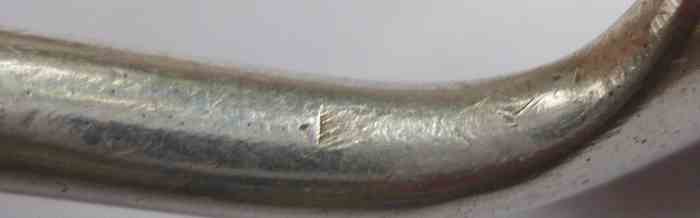 evidence of anvil mark on silver cheese scoop