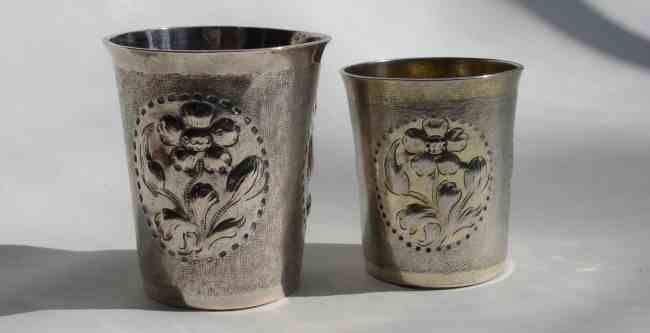 two silver beakers