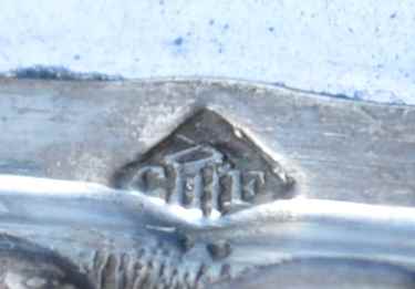 mark on silver mounts of a dish with Japanese decor