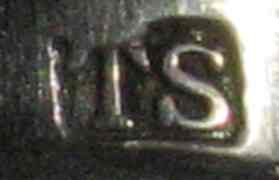 marks on cake knife made by Thomas Sansom