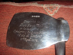 Silver ceremonial axe with wooden handle