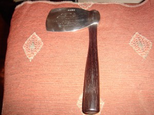 Silver ceremonial axe with wooden handle