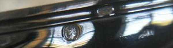 Hallmarks on the bottom outside edge of base