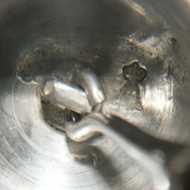 Underside of service bell with hallmarks, and clapper