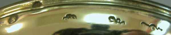 Hallmarks on the bottom outside edge of base