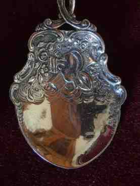 silver decorative spoon with cargo finial