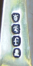 Hallmark on sugar tongs showing the crowned leopard's head used in the 1821/2 marking year
