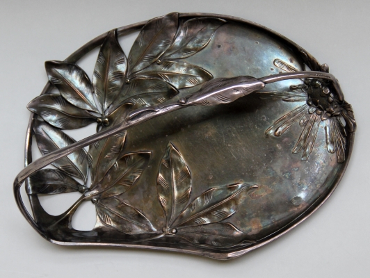 A decorative tray made in 1895-1915