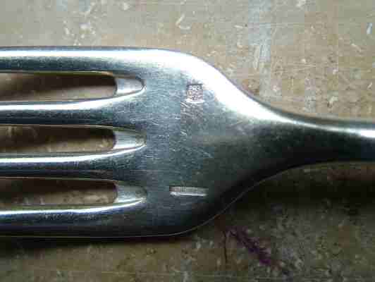 Disposition of Gombault-Desclercs marks on a fork Disposition of Gombault-Desclercs marks on a fork