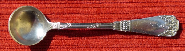 A silver-plated 10 cm long mustard spoon made from low-quality nickel silver in Empire style