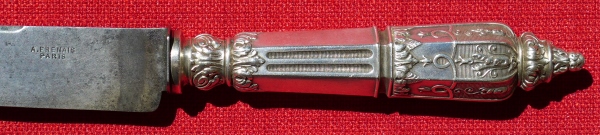 detail of a silver-plated bread knife made in Russian style
