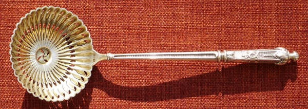 A silver-plated spoon for sugar powder made of nickel silver before 1902