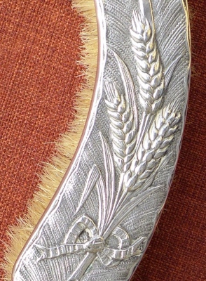detail of a brush for table cleaning made from low-quality nickel silver c.1890