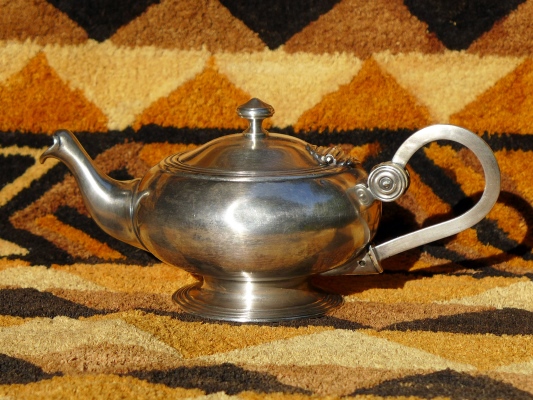 A teapot made from polished pure mtal extra-blanc (low-quality nickel silver)