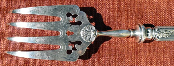A richly decorated silver-plated fish-fork