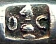 the 'knight' chess figure in a square box between two letters 'O' and 'C'
