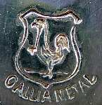 coat of arms with a Gallic cock inside and the inscription below GALLIA METAL