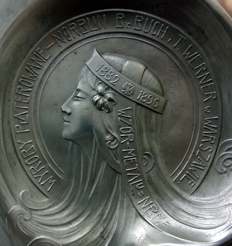 A fragment of silver-plated ashtray, issued by N.B.W between 1897 and 1915
