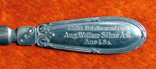 Inscriptions on the handle of Wellner silver-plated paper knife