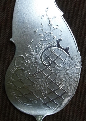 Detail of cake server issued between 1885 and 1903