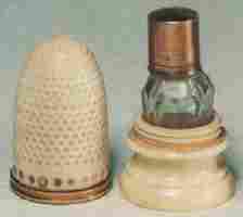 18c Ivory thimble and clear glass bottle