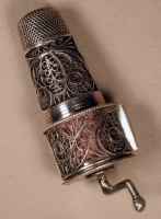 18c combination silver filigree thimble, clear glass bottle and tape measure