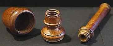 A combined 19c wooden thimble and needle holder