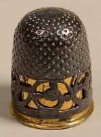 'Complete' silver filigree thimble and gilt liner